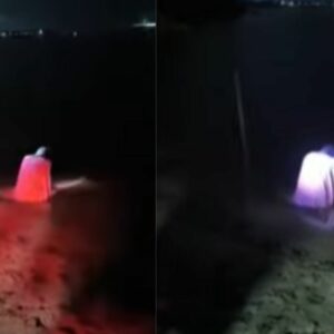 Guardas abordam mulher na praia durante suposto ritual  | Imagem: SBT News